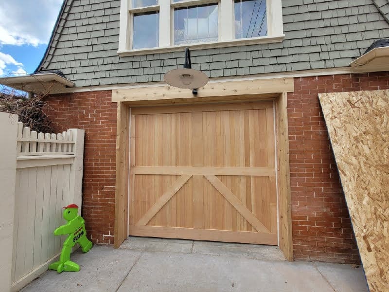 Custom Cedar Sectional Overhead Door Installation in Boulder image