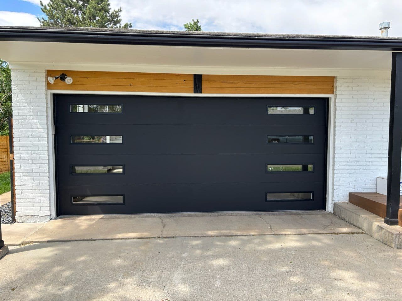 Gallery photos for Revamp Your Home with a Stylish Black Garage Door: Image #1