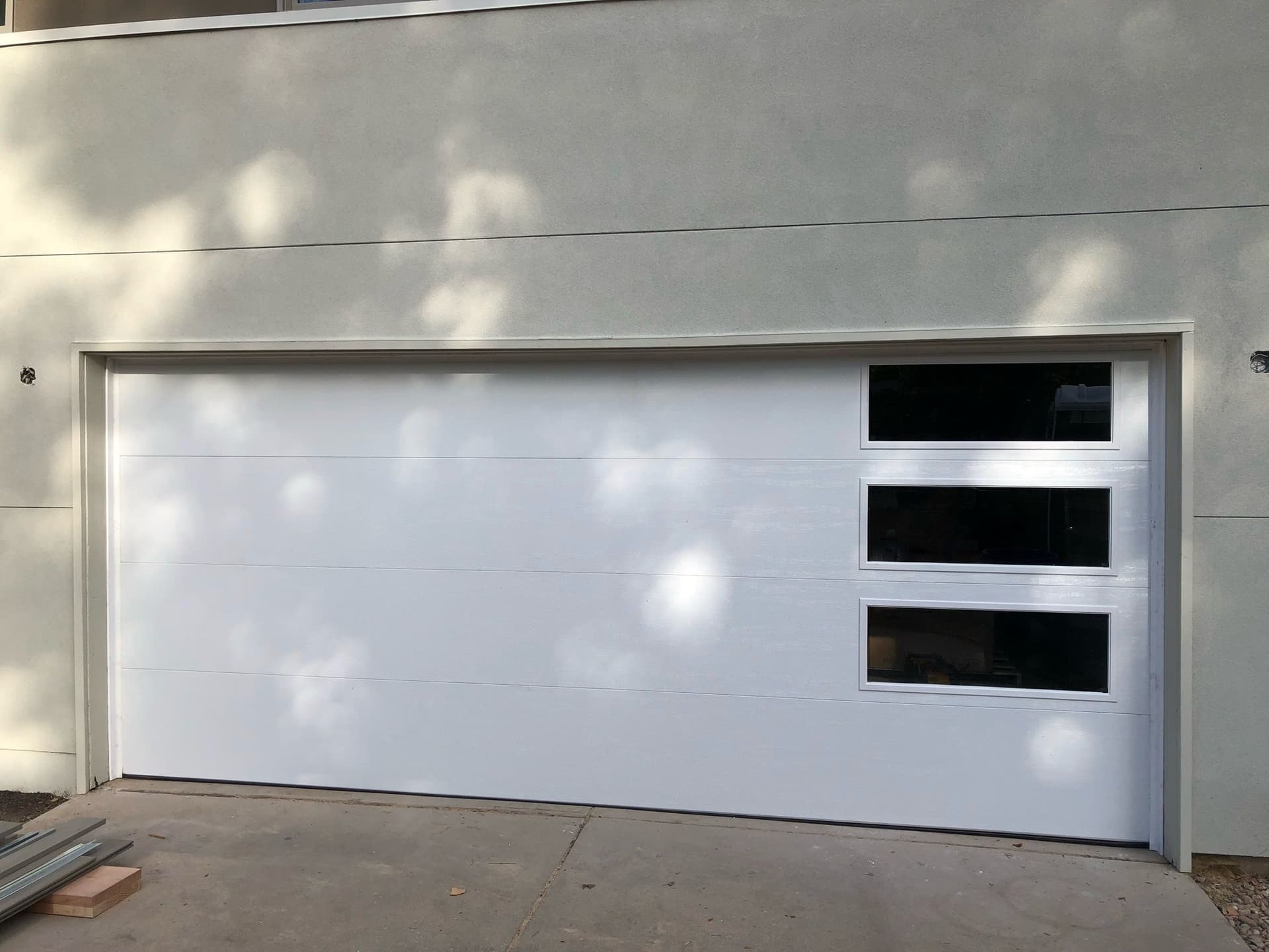 Sleek Garage Door Installation with Side Windows in Colorado image