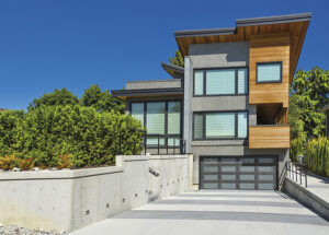 A contemporary home with complementary garage door style.