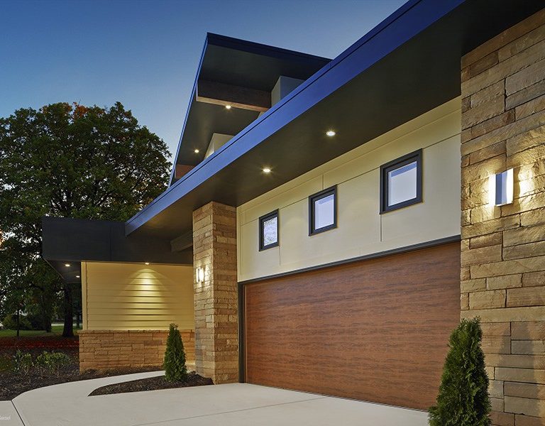 A custom garage door that aligns with color scheme and layout of the home.